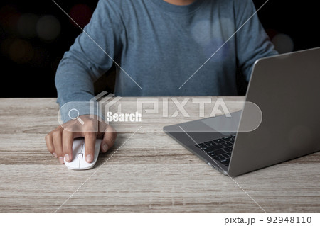 Man working with computer laptop searching browsing internet data information Man working with computer laptop searching browsing internet data information 92948110