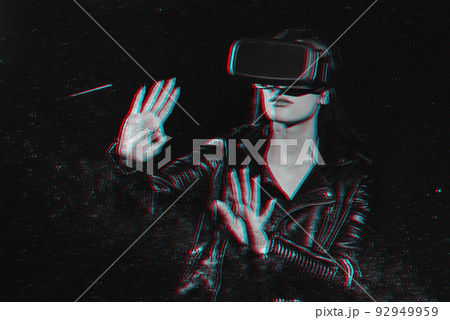 girl in virtual reality glasses is immersed in augmented reality with the help of modern technologies girl in virtual reality glasses is immersed in augmented reality with the help of modern technologies 92949959