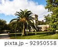 City park with green trees and palm trees. Valencia Central Park with gardens and green trees. 92950558