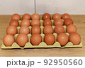 Chicken egg in box. Natural organic eggs in cardboard package on table in kitchen. 92950560
