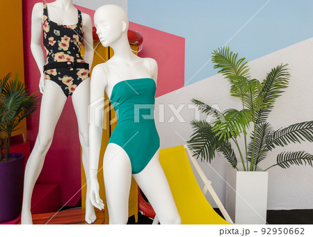 Mannequins in colorful swimsuits in clothes shop. Summer vacation. Fashion model. Colorful vacation concept 92950662