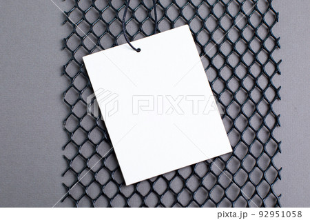 Blank tag tied with string. Price tag, gift tag, sale tag, address label on gray background modern Technology design  92951058