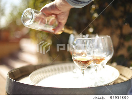 Many glasses and bottle of rose wine in the autumn vineyard 92952390