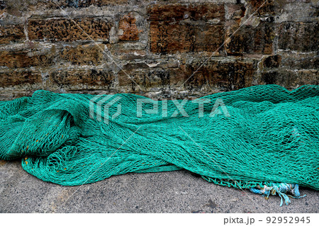 Old Harbour Wall with Fishing Nets Drying in the Open Air Old Harbour Wall with Fishing Nets Drying in the Open Air 92952945