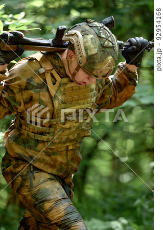Soldiers game on military training ground battle camp. Action. Operation Trainer giving training to military soldiers at boot camp 92954168