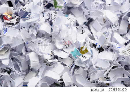 Cross cut shredded paper background texture top view Cross cut shredded paper background texture top view 92956100