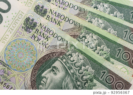 Polish paper currency, 100 zloty PLN bills closeup background top view 92956367