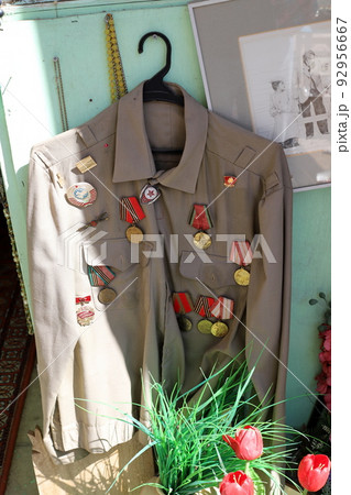 A mannequin stands on a showcase in a store. A mannequin stands on a showcase in a store. 92956667
