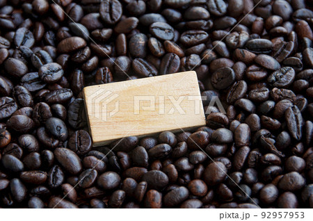Blank wooden block surrounded by coffee bean. Copy space Blank wooden block surrounded by coffee bean. Copy space 92957953