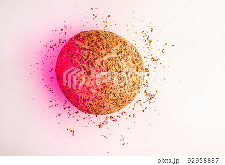 Fresh Artisan round Bread or bun with sesame and flax seeds Isolated on White Background with pink spotlight. Flat lay. Food concept. 92958837