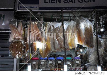 Street food in Saigon, Vietnam. Hanging fish in the market Street food in Saigon, Vietnam. Hanging fish in the market 92961840