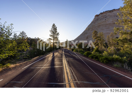 Scenic Road in American Mountain Landscape. Sunny Morning Sunrise Sky Scenic Road in American Mountain Landscape. Sunny Morning Sunrise Sky 92962001