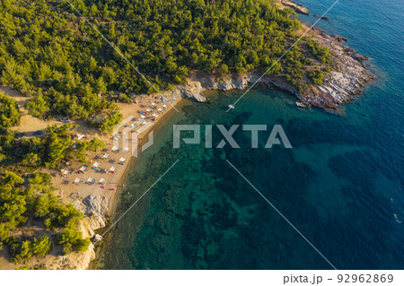 Aerial drone view of beach umbrellas and sunbeds 92962869