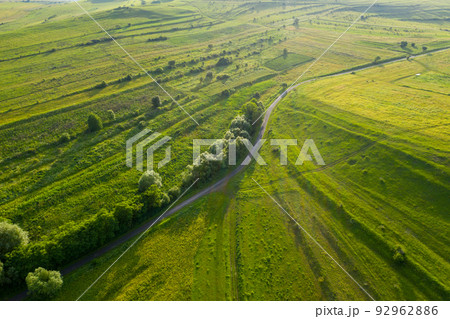 Aerial view of countryside vibrant green hills. Transylvania, Romania 92962886