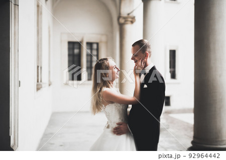 Caucasian happy romantic young couple celebrating their marriage. Outdoor 92964442