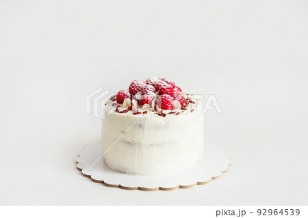 A small cake with raspberries on top and a mastic leaf. 4677576 Vector Art  at Vecteezy