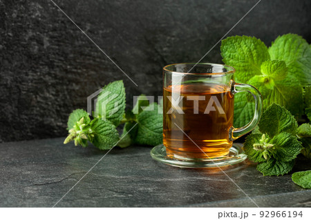 Mint tea on a black table. 92966194
