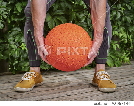 fitness workout with a heavy slam ball fitness workout with a heavy slam ball 92967146