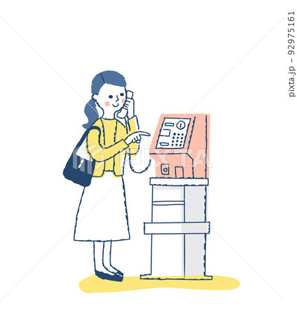 公衆電話で災害用伝言ダイヤル171を利用する女性 92975161