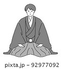 着物を着て正座する男性（和装婚） 92977092