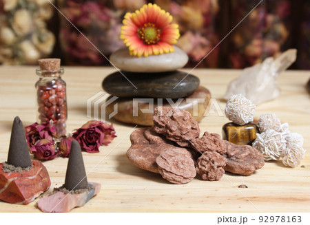 Incense Cones and Desert Rose Rocks on Meditation Table 92978163