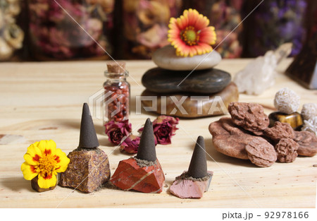 Incense Cones and Desert Rose Rocks on Meditation Table 92978166
