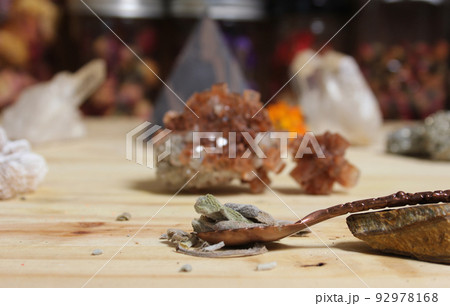 Sage in Vintage Spoon on Meditation Altar With Pyramid in Background 92978168