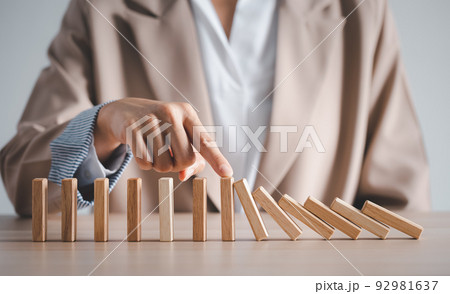 wood block row fallen by woman finger 92981637