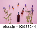 Flat lay composition with lavender flowers and natural cosmetics on a pink background. 92985244
