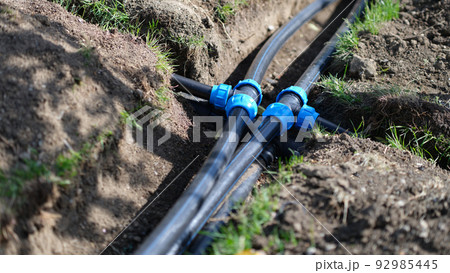 Installed PVC water pipes in trench at summer cottage Installed PVC water pipes in trench at summer cottage 92985445