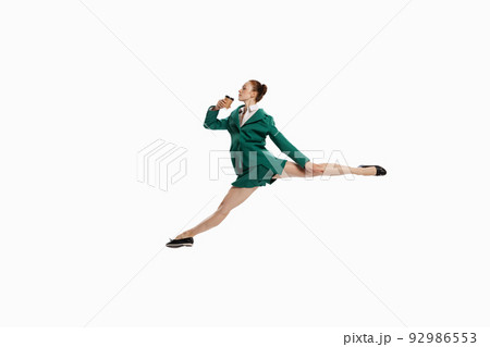 Stylish young woman in business style outfit in motion isolated over white background. Emotions, finance, aspiration, business, job concept. 92986553