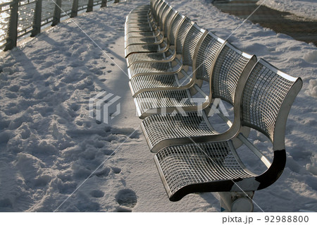 The metallic benches and the white snow during winter The metallic benches and the white snow during winter 92988800