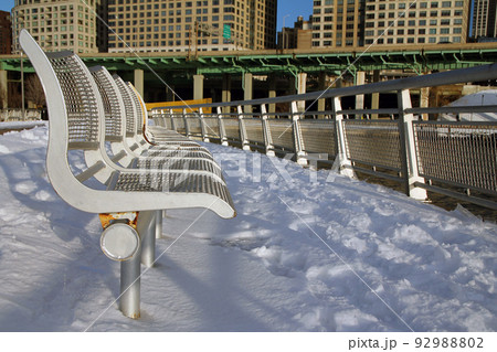 The benches, the snow, the river, the highway and the skyscrapers 92988802