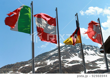 Italian, Austrian, German and Swiss Flags in the wind Italian, Austrian, German and Swiss Flags in the wind 92988944