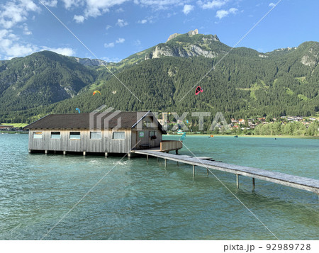 The floating wooden house on the turquoise waters of Achensee The floating wooden house on the turquoise waters of Achensee 92989728