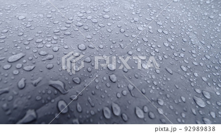 Raindrops on a blue tent close-up. Foggy morning in the Carpathians. Raindrops on a blue tent close-up. Foggy morning in the Carpathians. 92989838