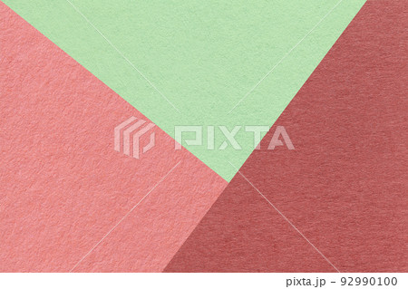 Texture of craft red, pink and green shade color paper background, macro. Structure of vintage abstract rose cardboard 92990100