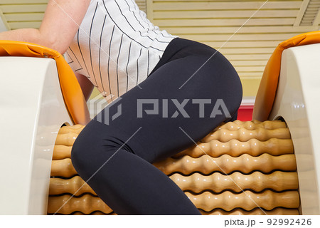 woman making massage for leg femur. Roll Massage machine is a way to shape  the figure. Skin Care, body care concept. modern relax massage equipment  Stock Photo - Alamy