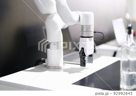 Rendering of robotic arm working in factory 92992645