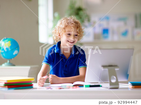 Online remote learning. School kids with computer. Online remote learning. School kids with computer. 92994447