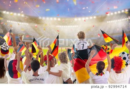 Germany football team supporter on stadium. Germany football team supporter on stadium. 92994714