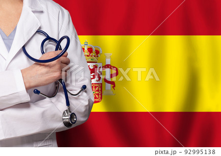 Spanish medicine and healthcare concept. Doctor close up against flag of Spain background 92995138