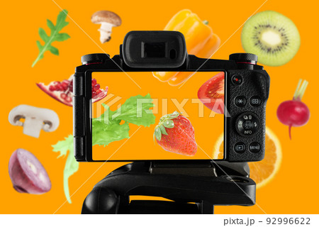 Vlogger records a video of fresh fruit recipe Vlogger records a video of fresh fruit recipe 92996622