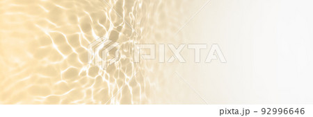 Surface of toned in pastel yellow swimming pool water with light reflection and waves. Texture of transparent water with waves in swimming pool. Long Trendy abstract banner with white copy space. Surface of toned in pastel yellow swimming pool water with light reflection and waves. Texture of transparent water with waves in swimming pool. Long Trendy abstract banner with white copy space. 92996646