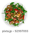 Salad with arugula and chanterelle mushrooms on plate 92997093