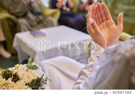 Bride and groom Asian Muslims marry in a beautiful red love theme. celebration nikah day. 92997160