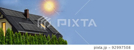 Photovoltaic black panels on roof. Roof of solar panels. View of solar panels (solar cells) in roof house with sunlight. Copy-space, web banner. Photovoltaic black panels on roof. Roof of solar panels. View of solar panels (solar cells) in roof house with sunlight. Copy-space, web banner. 92997508