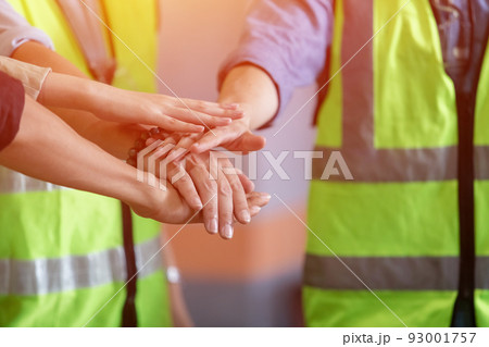 Team engineering and foreman connect joining hands together, Stack of hands. Team engineering and foreman connect joining hands together, Stack of hands. 93001757