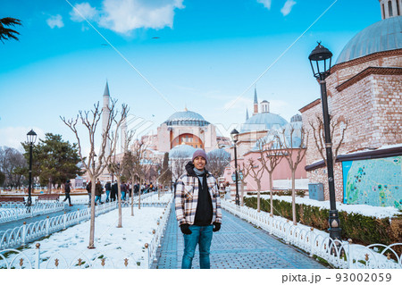 man smiling in front of turkey most popular mosque attraction man smiling in front of turkey most popular mosque attraction 93002059