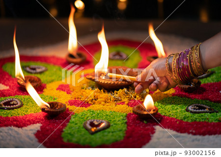 Traditional diya lamps lit during diwali celebration 93002156